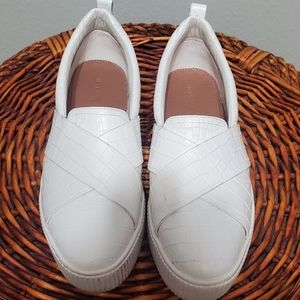White platform slip ons